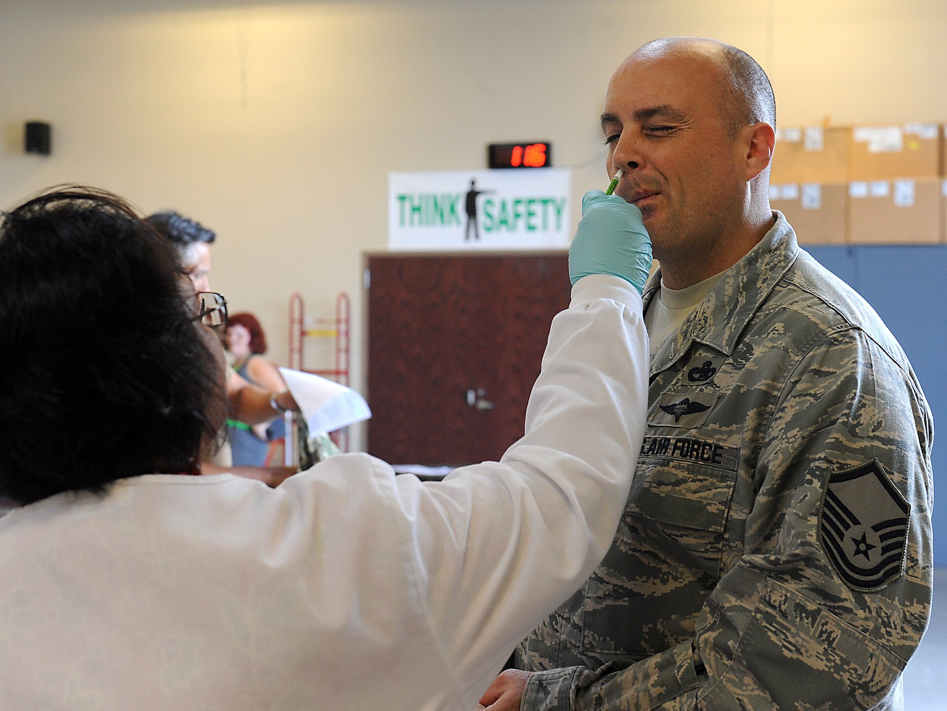 A healthcare worker preparing a measles vaccination dose