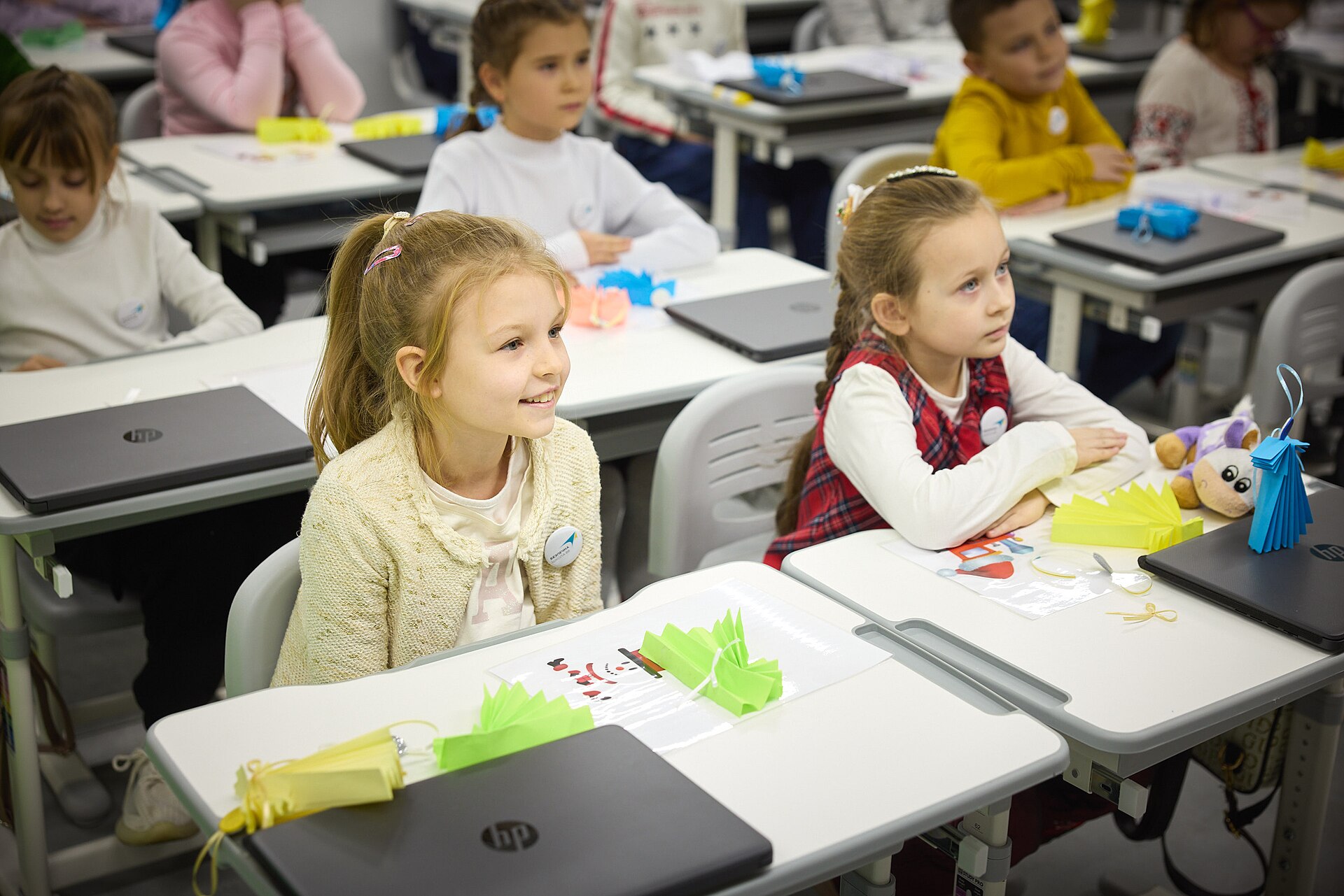 Students in a classroom with smartphones put away during a lesson